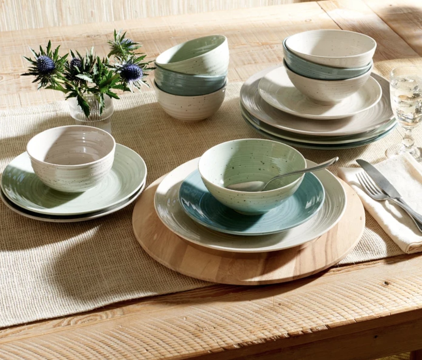 The green, blue and cream dishes set out on table