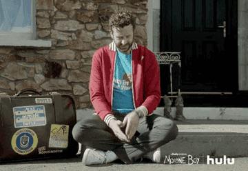GIF of Chris O&#x27;Dowd as Sean Murphy in the show &quot;Moone Bow&quot; looking at his watch