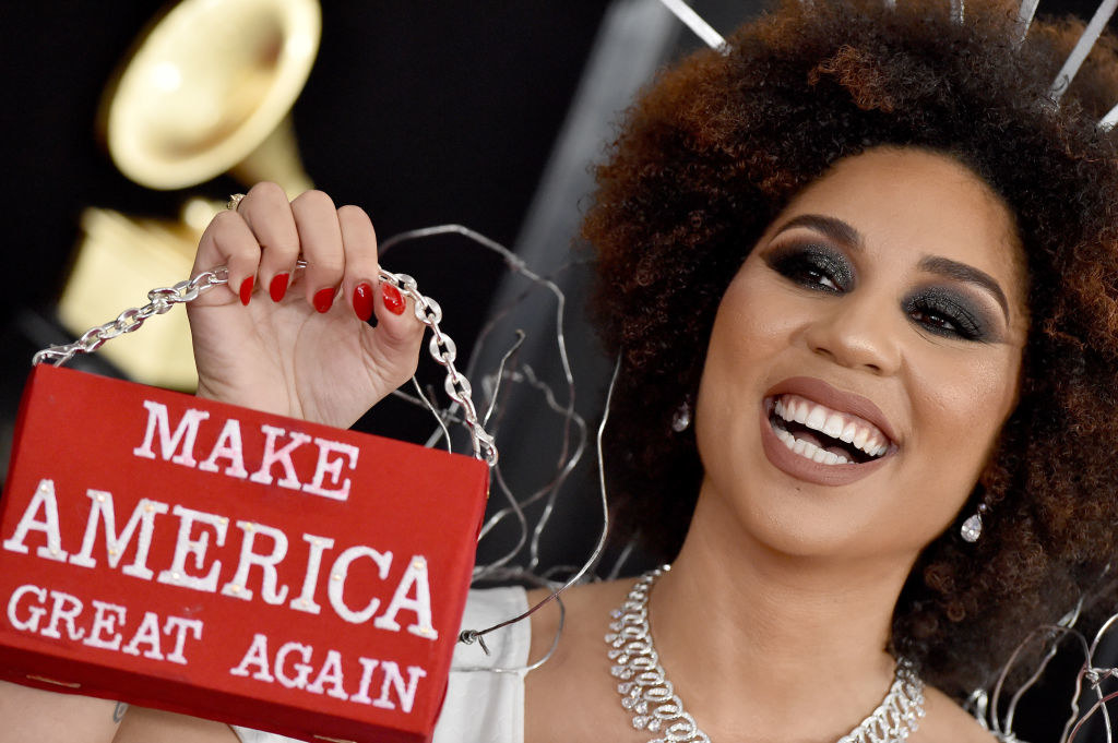 At a different event, Joy holds up a bag that says &quot;make America great again&quot;