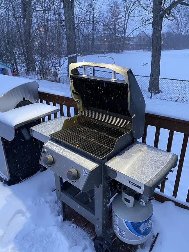 Reviewer's photo of lights set up on grill while it snows