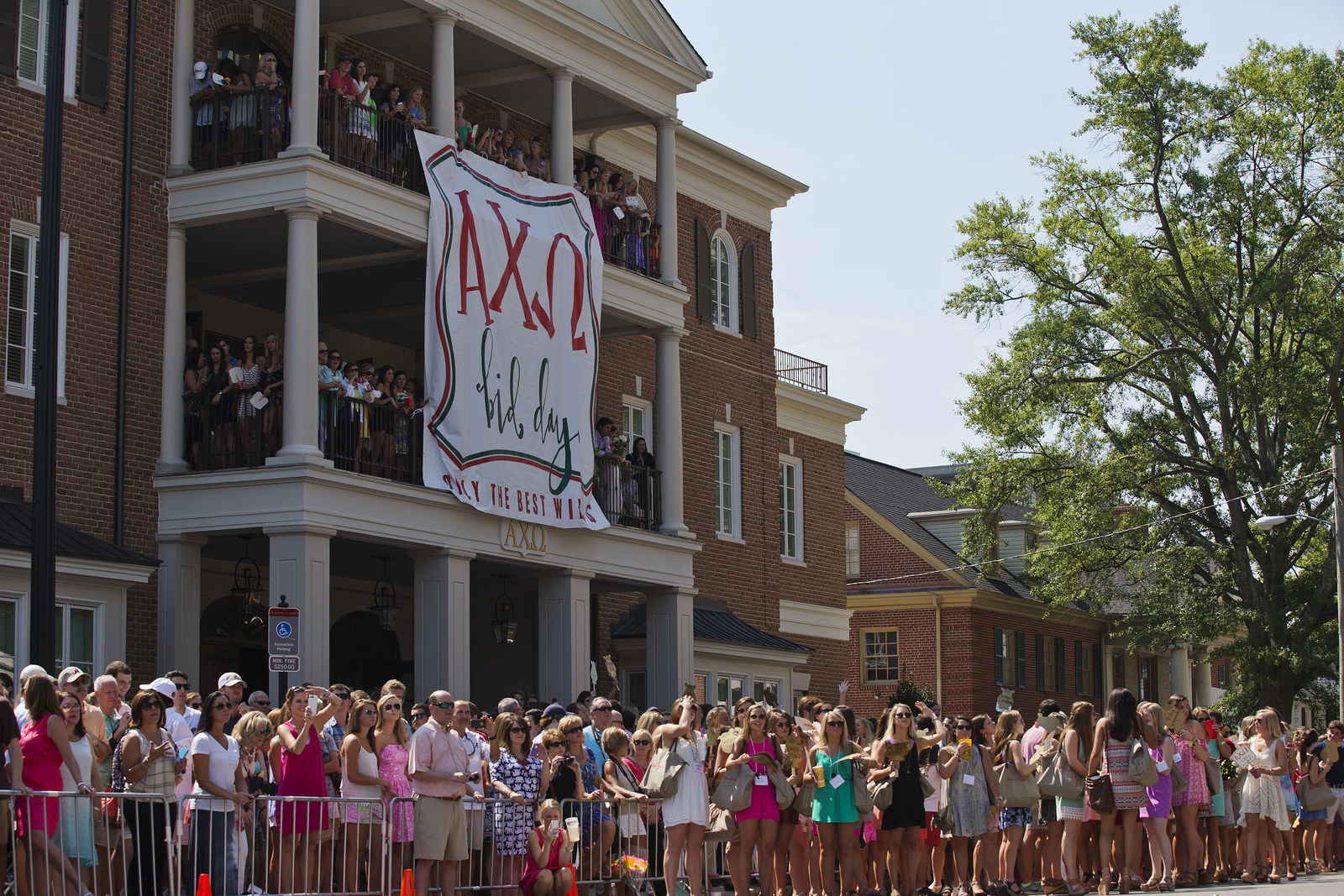 Sorority girls lined up outside a house