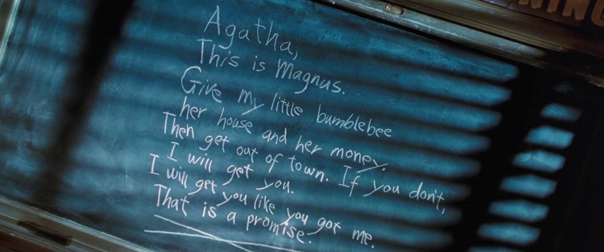 A blackboard with writing on it, including &quot;Agatha, this is Magnus; give my little bumblebee her house and her money&quot;