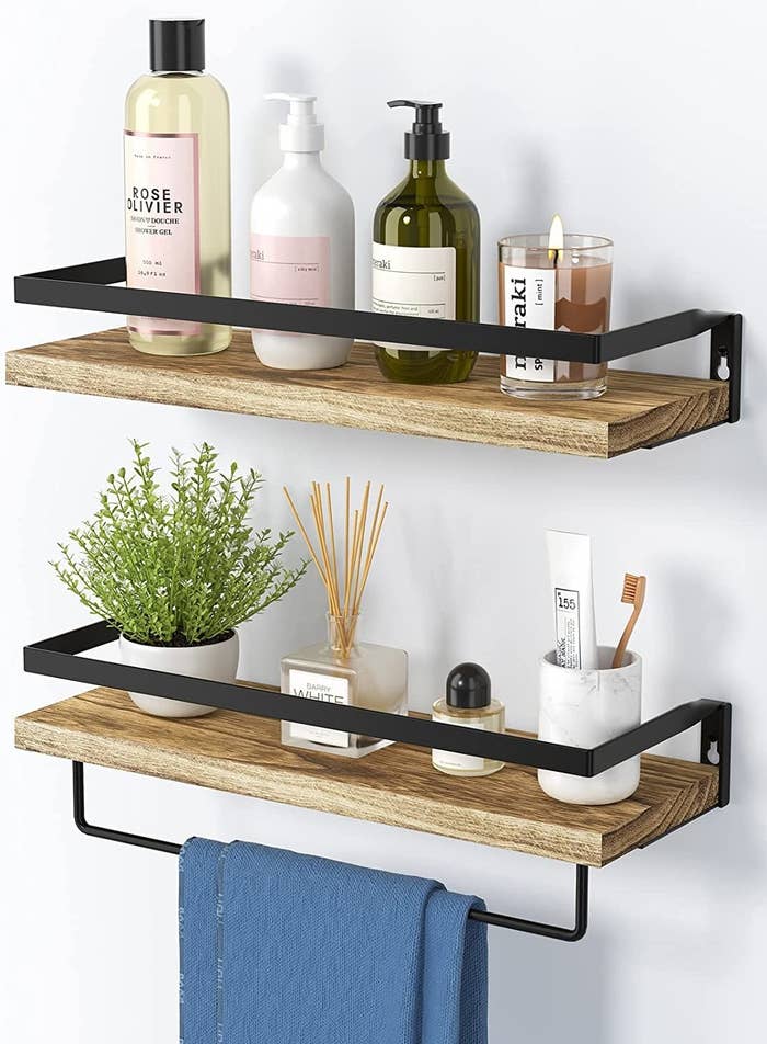 floating shelves with plants and bathroom items on them