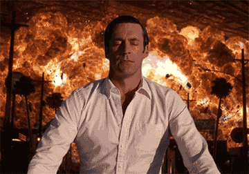Zooming in on Jon Hamm with fire in the background
