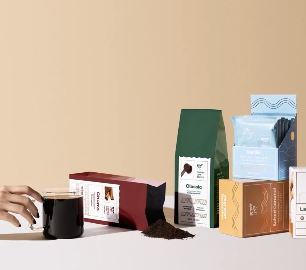 Image of coffee cup and bags and boxes of coffee and creamer