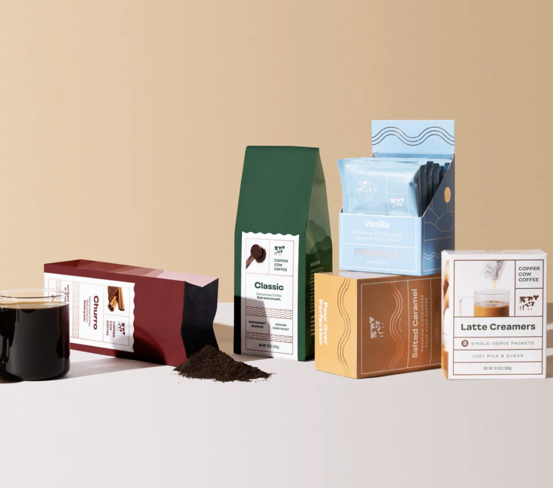 Image of coffee cup and bags and boxes of coffee and creamer