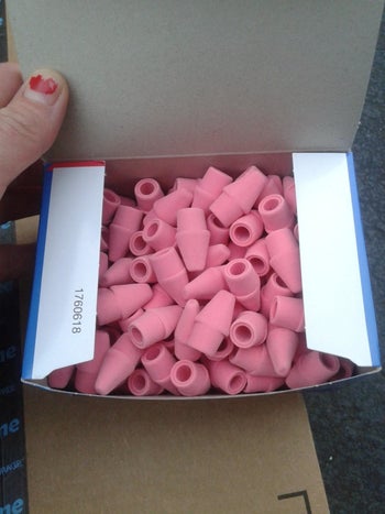 reviewer's photo of the pink cap erasers