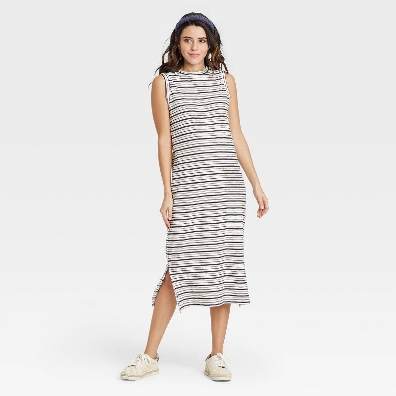 Model wearing the cream striped dress