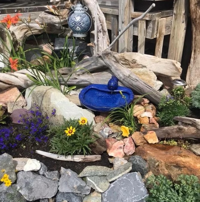 A reviewer&#x27;s image of the small ceramic koi fountain