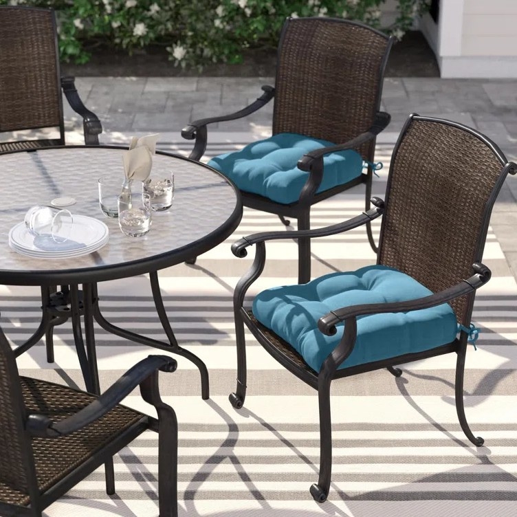 A set of two sky blue outdoor seat cushions