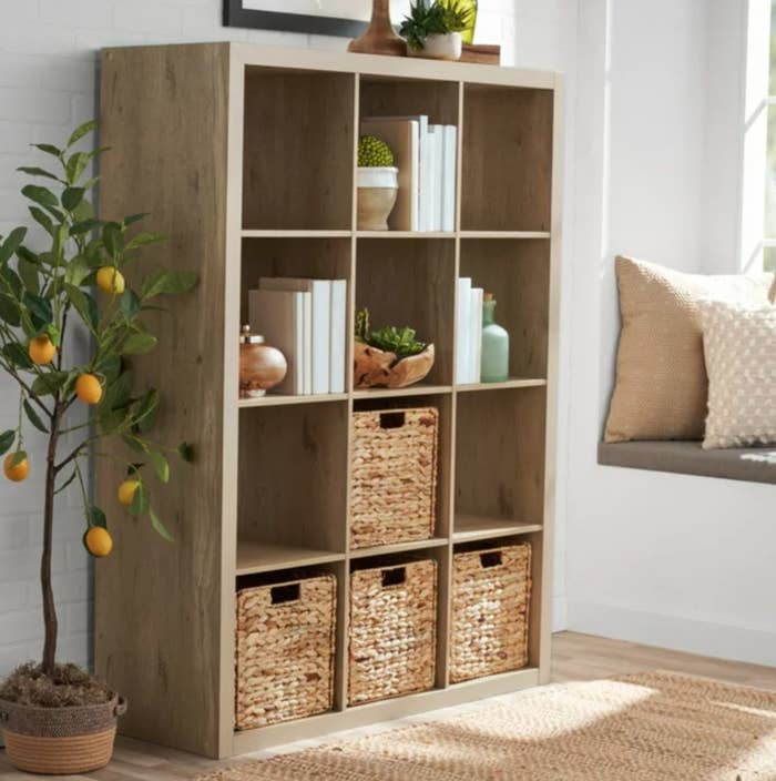 the 12-cube organizer with books and bins in a styled living space