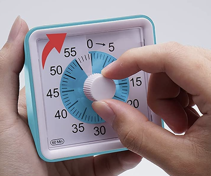 A model adjusting the time on a small square-shaped blue clock