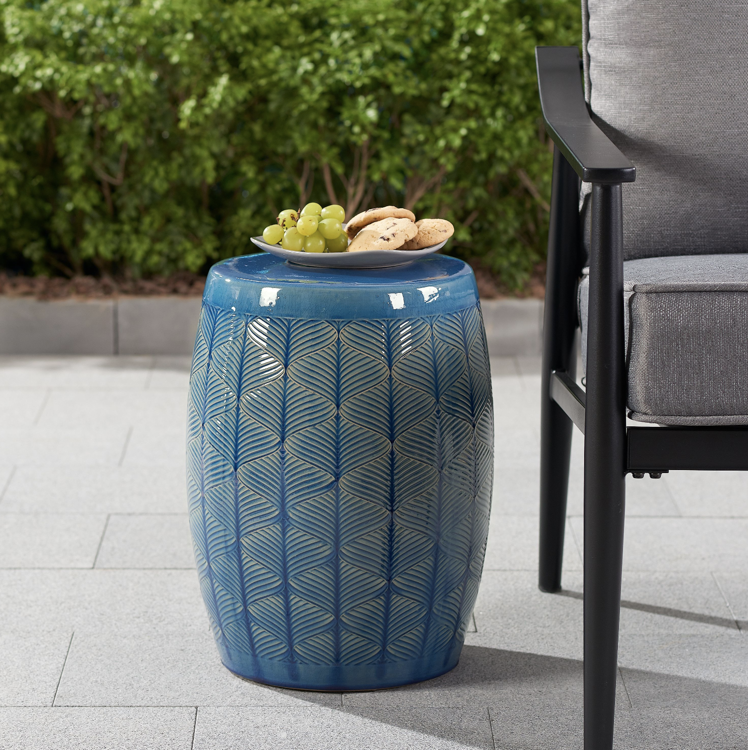 blue ceramic cylinder stool with painted design