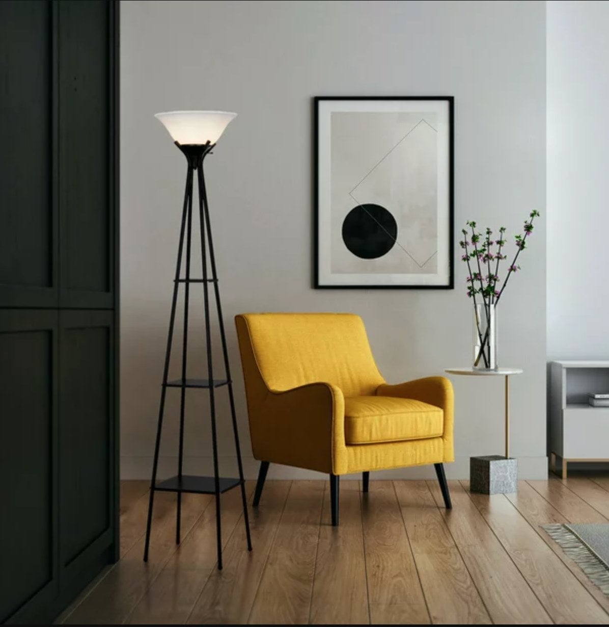the black lamp next to a yellow easy chair in a decorated living space