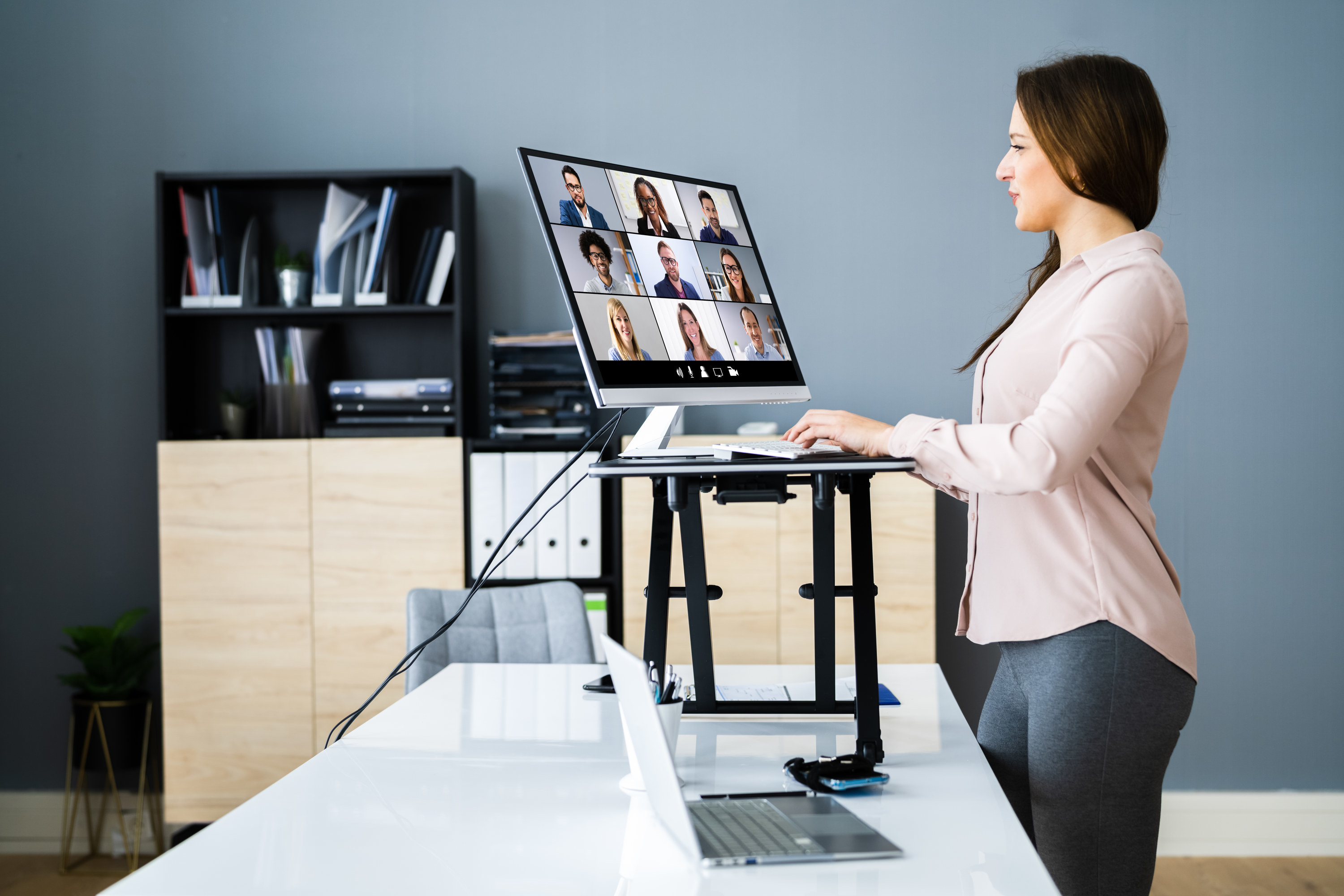 a person working at their standing desk