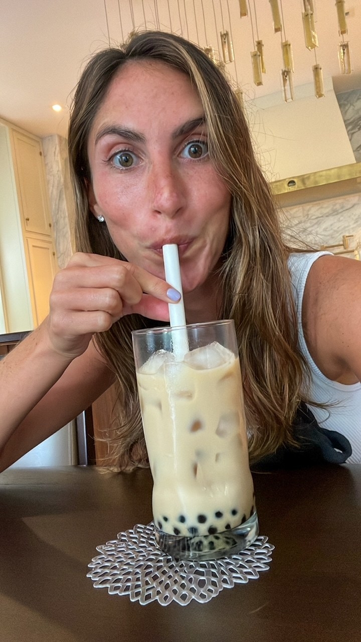 A woman drinking boba tea.