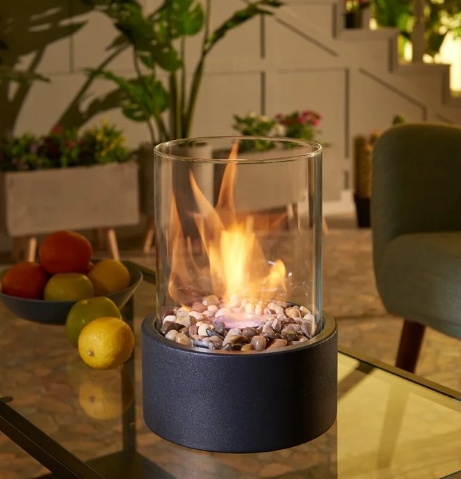 A tabletop fireplace with flame guard