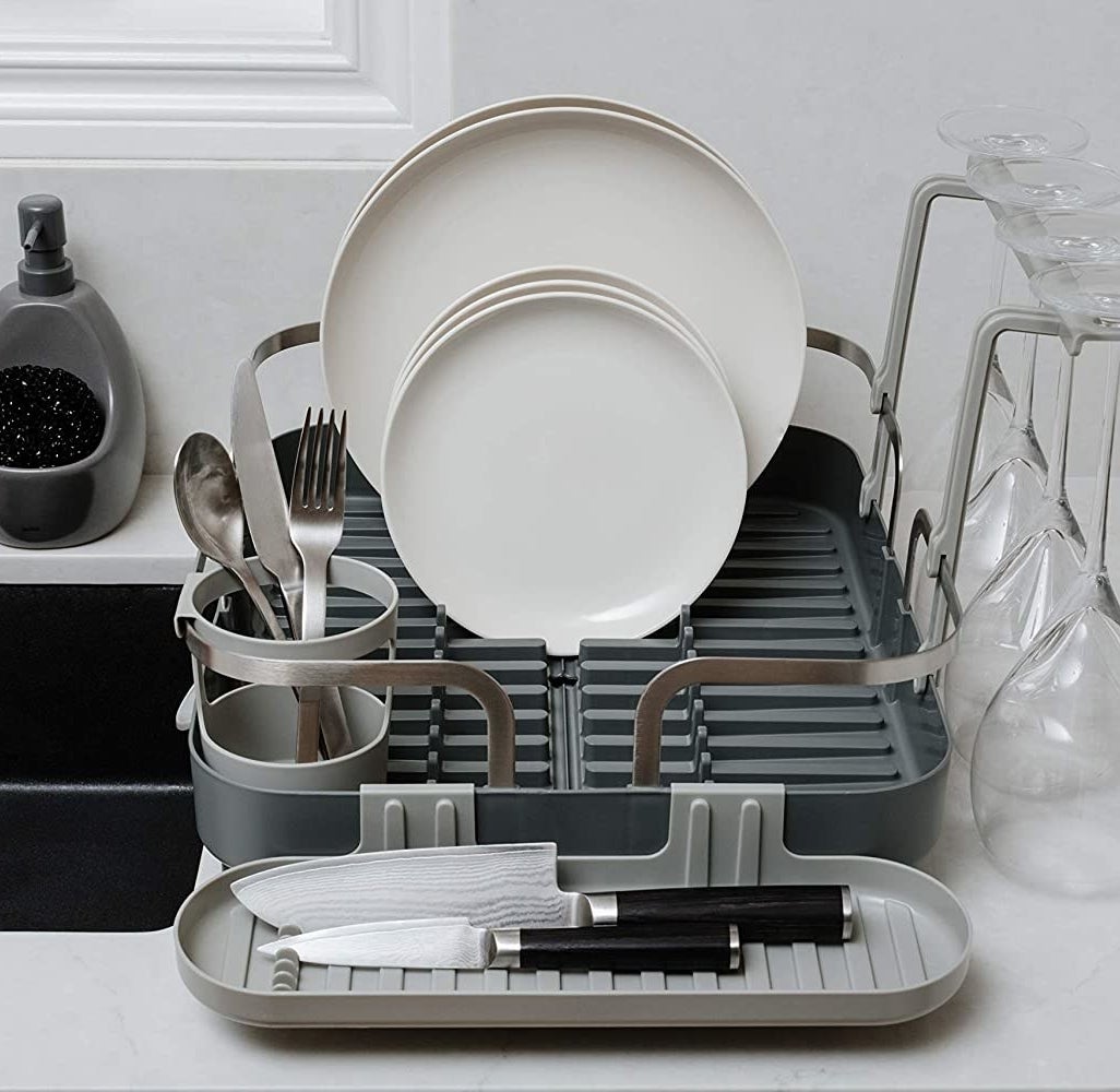 a dish drying rack with several compartments