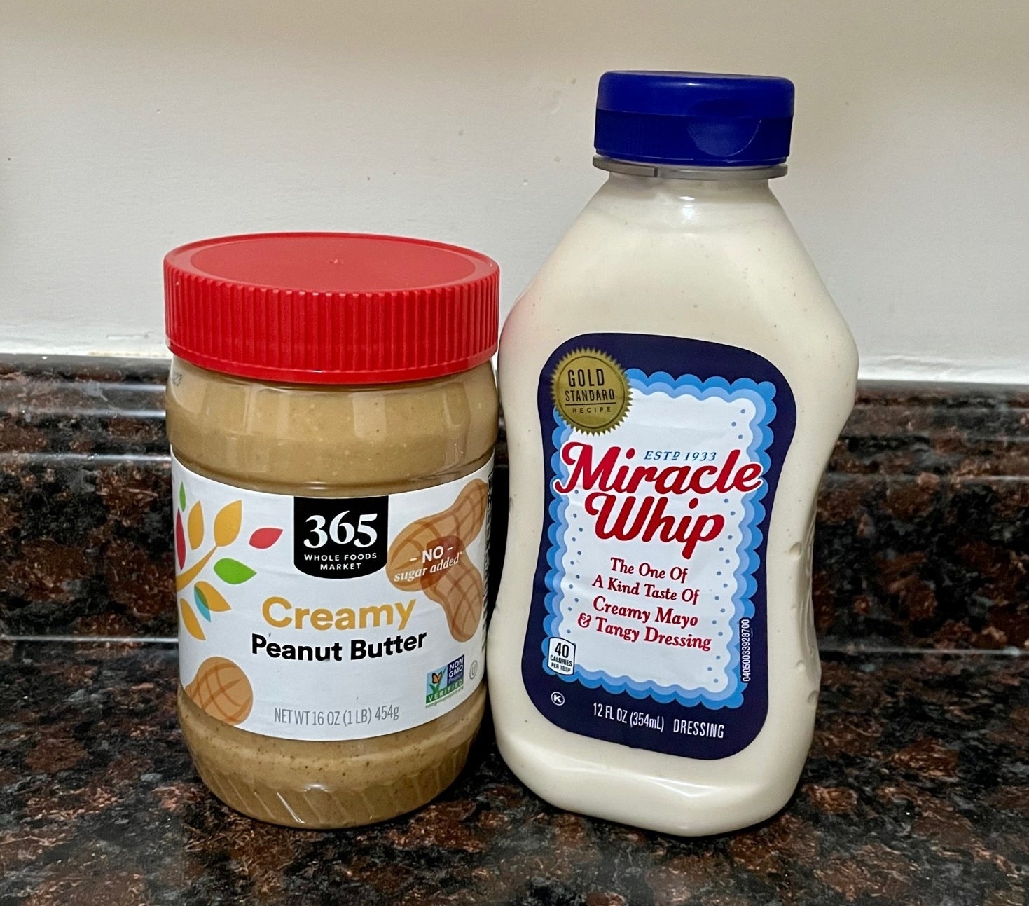A jar of peanut butter and jar of mayo