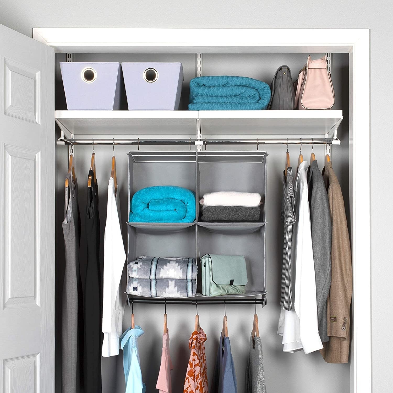 a hanging closet organizer with four compartments