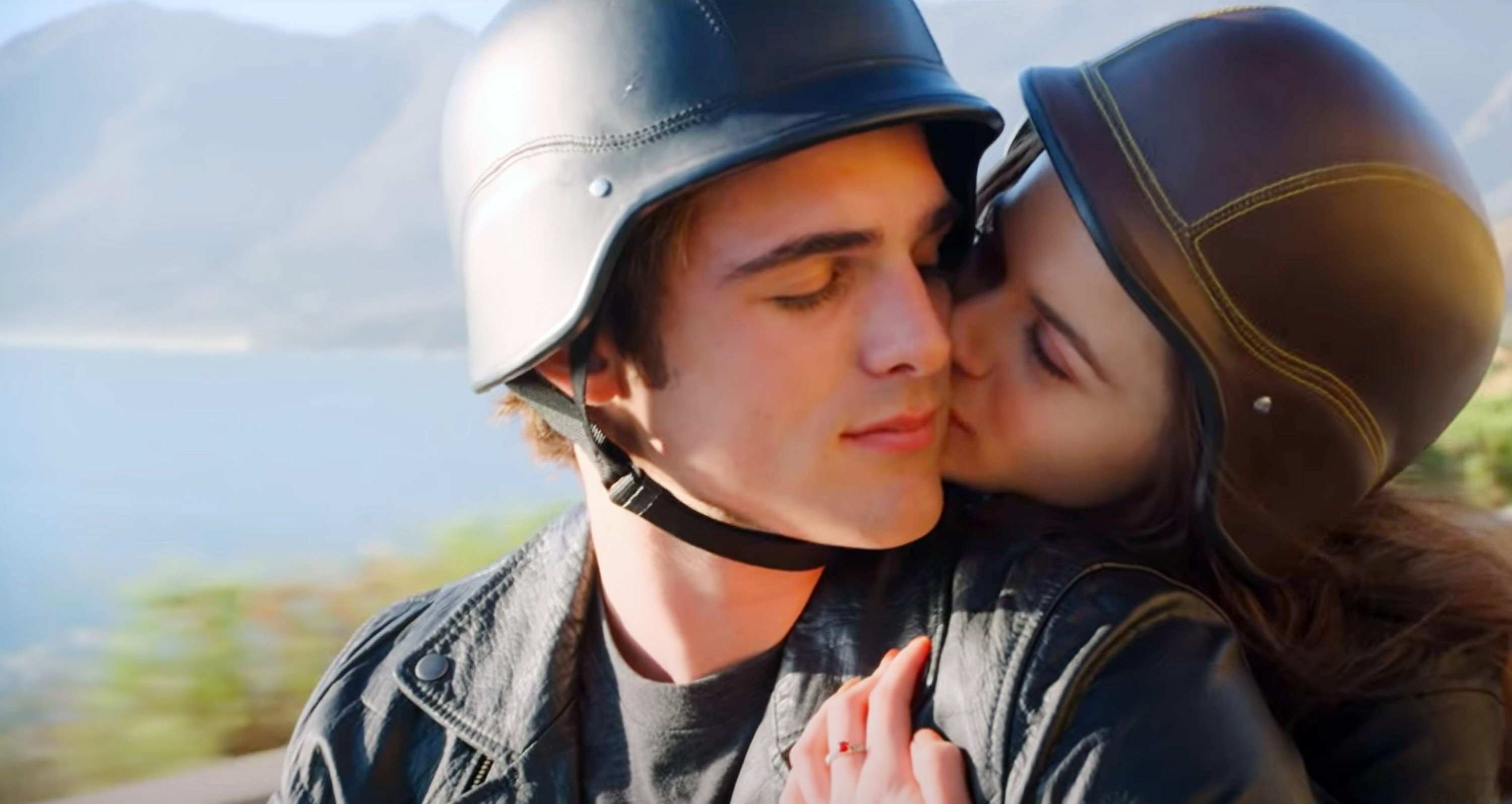 Jacob Elordi riding a motorcycle with a girl, who is kissing him