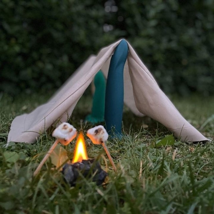 Two green dildos under canvas "pitching a tent"