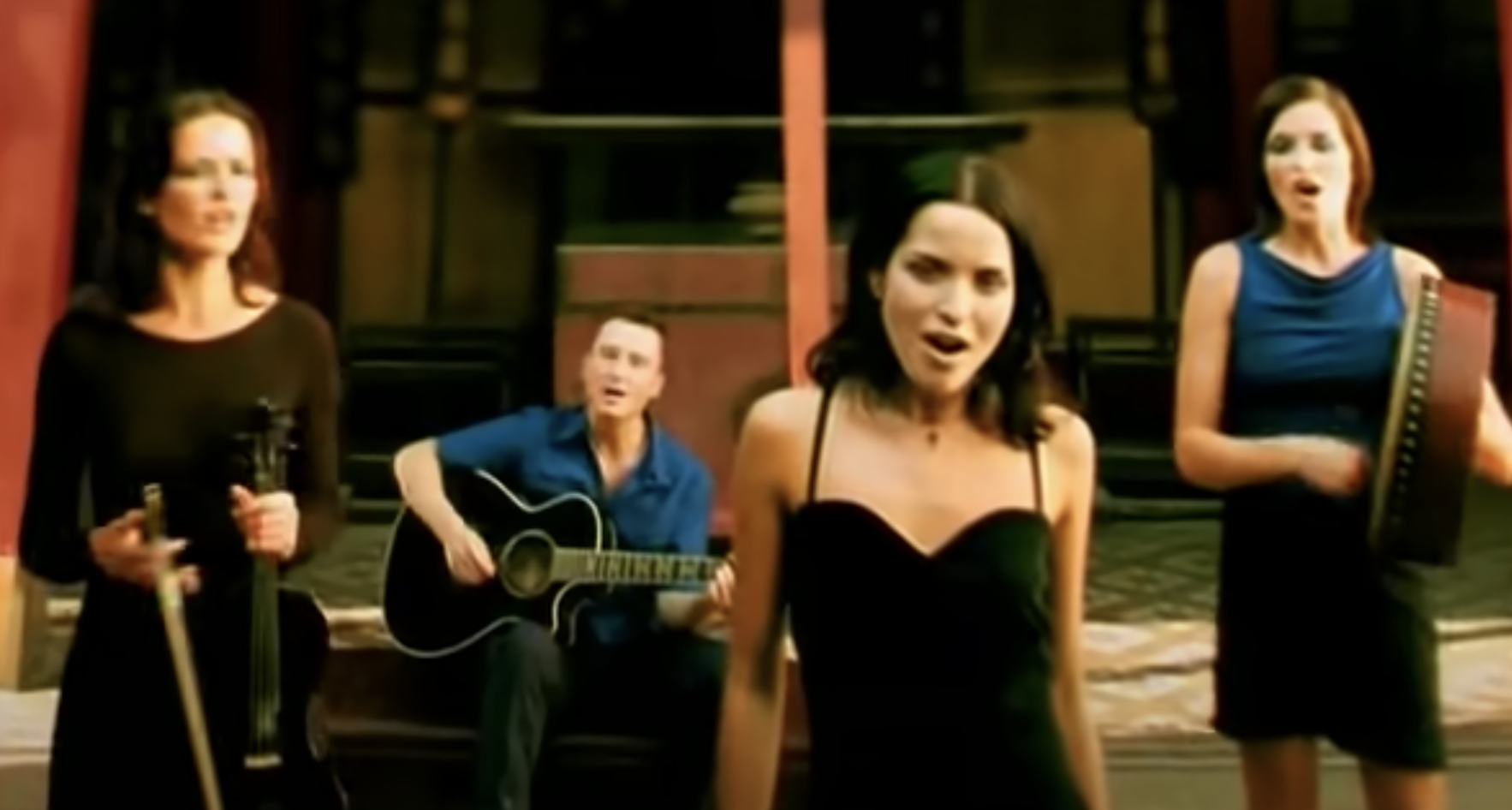 The Corrs performs &quot;Dreams&quot; with a guitar, violin, and drum