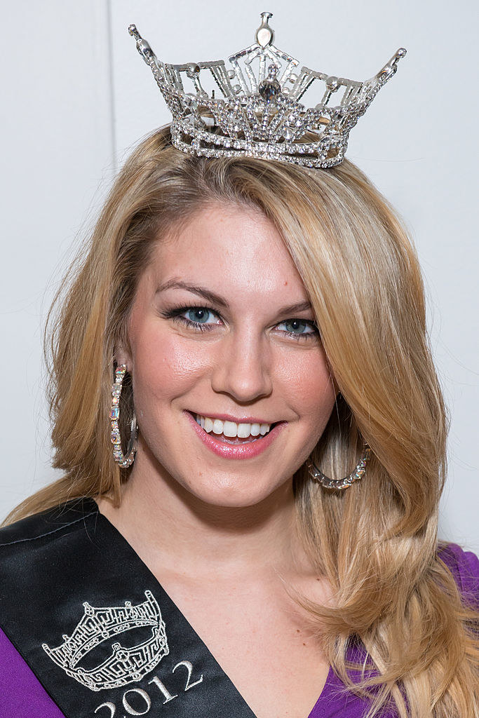 Hagan wearing her crown and smiling