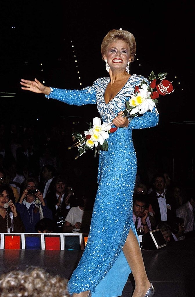 Carlson waving onstage after being crowned