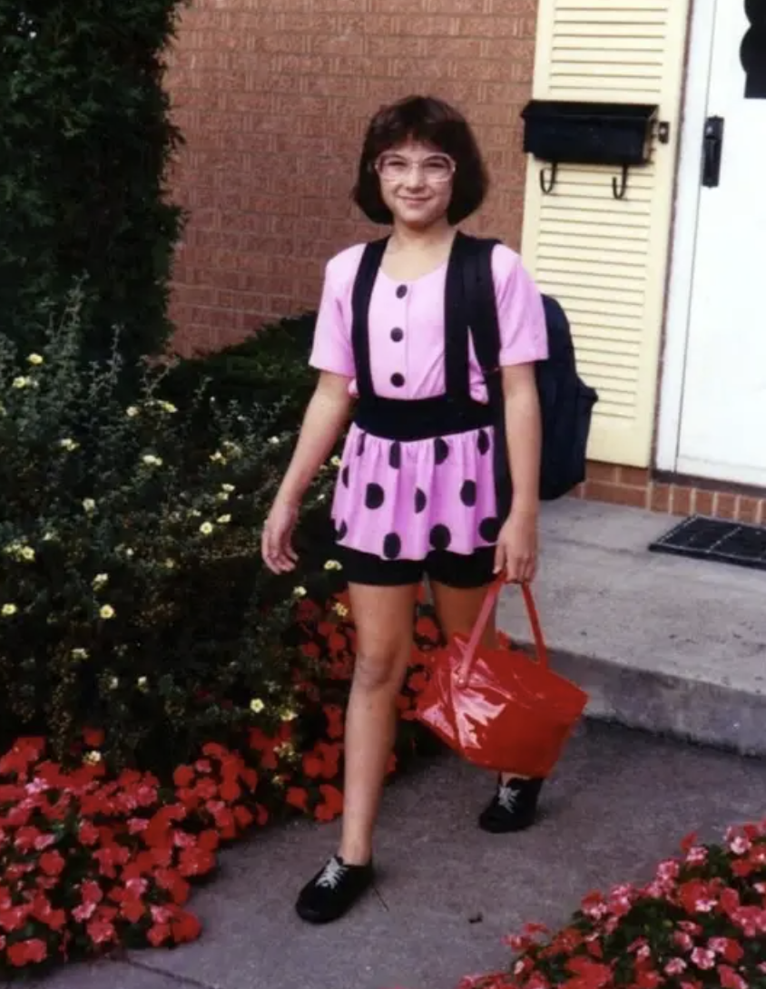 A girl wearing a polka dot skirt with bike shorts underneath
