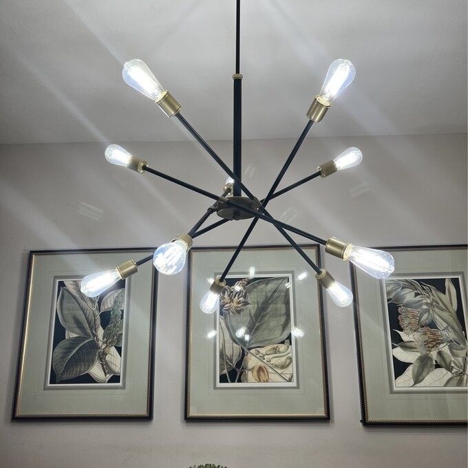 a reviewer photo of the matte black chandelier