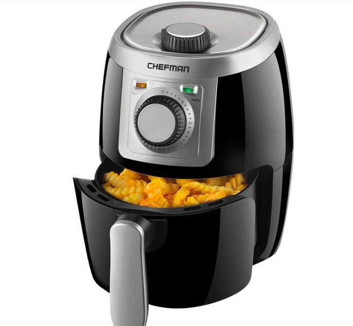 Air fryer with curly fries in it