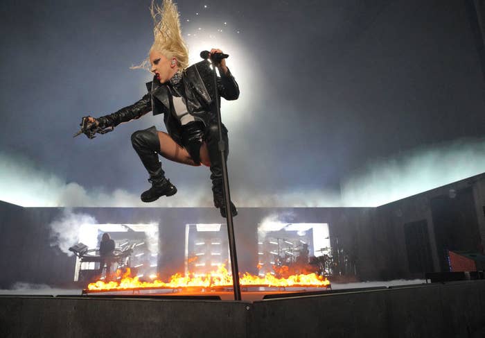 Lady Gaga jumping in the air during a performance