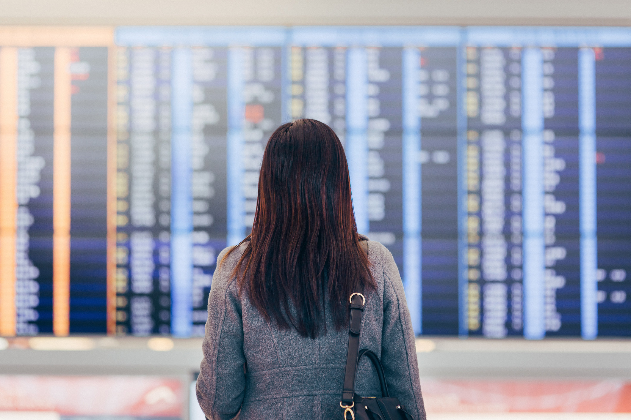 person looking at a flight schedule