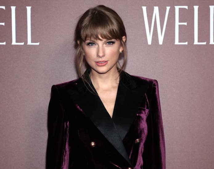 A closeup of Taylor in a velvet pantsuit