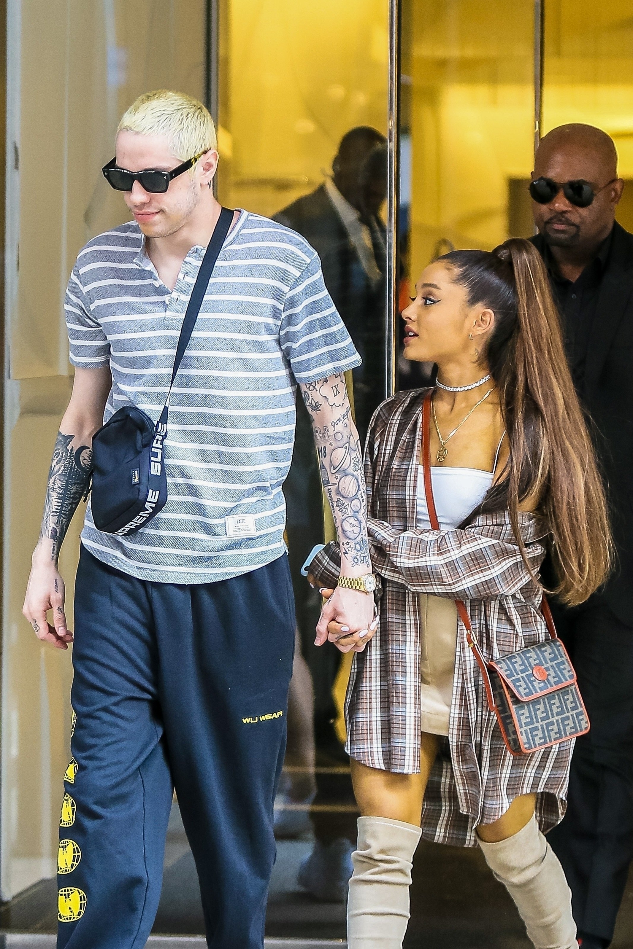 Pete and Ariana holding hands and walking