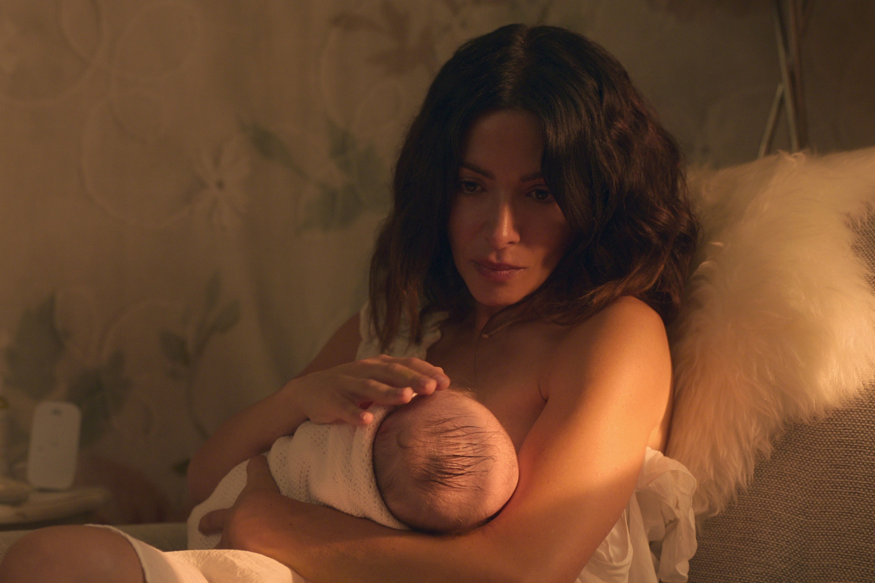 Sarah Shahi breastfeeds a baby