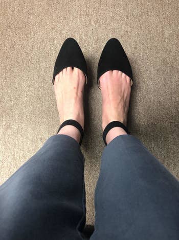 reviewer wearing the shoes in black