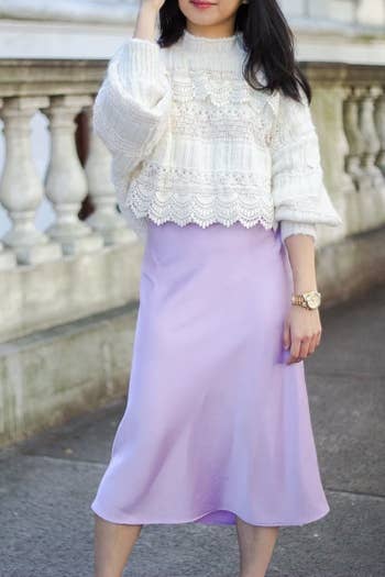 reviewer wearing a lilac midi skirt