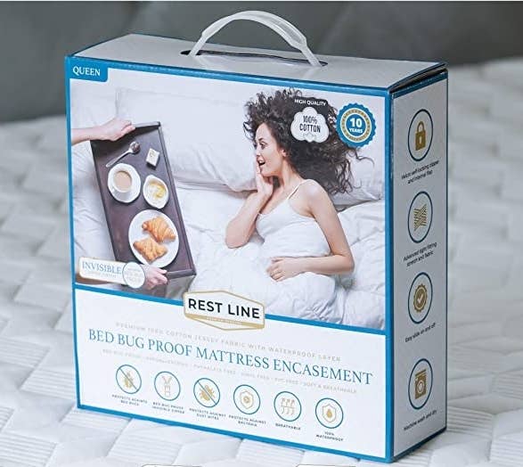 the packaging of the cover on a bed in a room