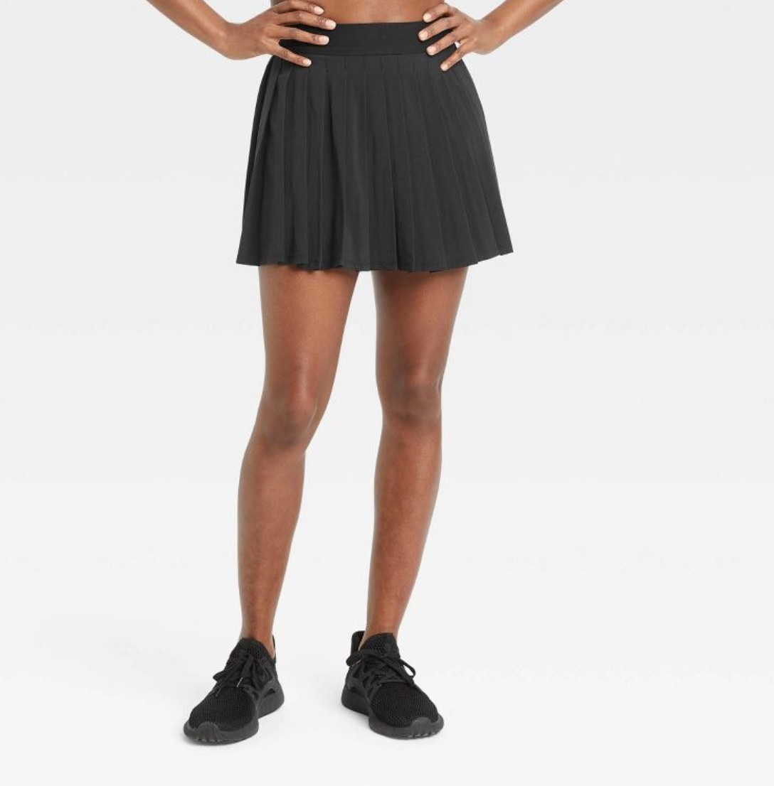 a model wearing the skirt in black