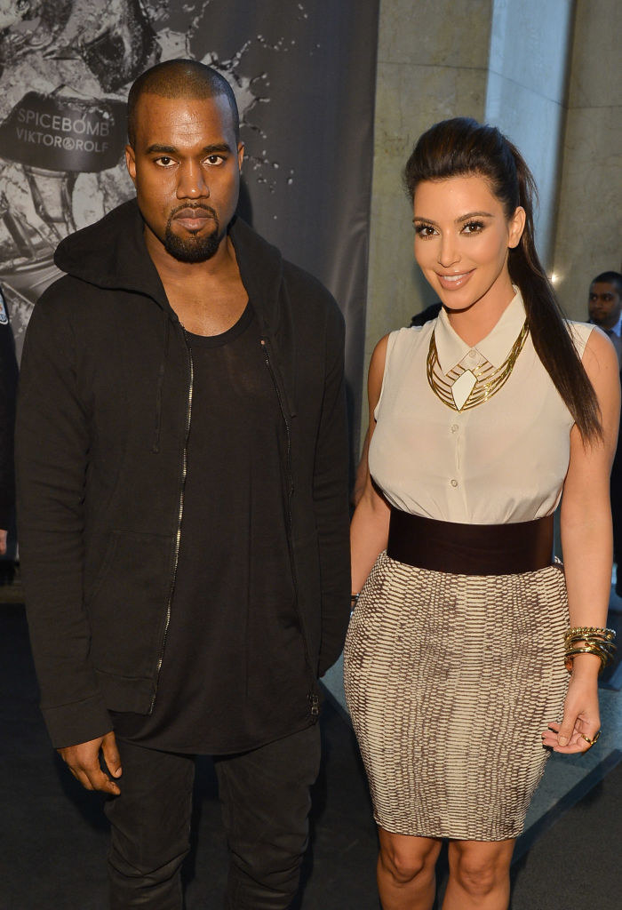 Kanye and Kim posing for a photo