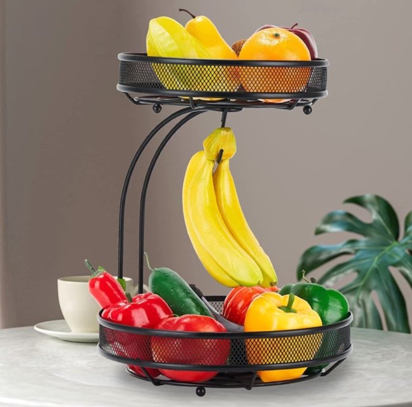 the black basket with fruits and vegetables in it