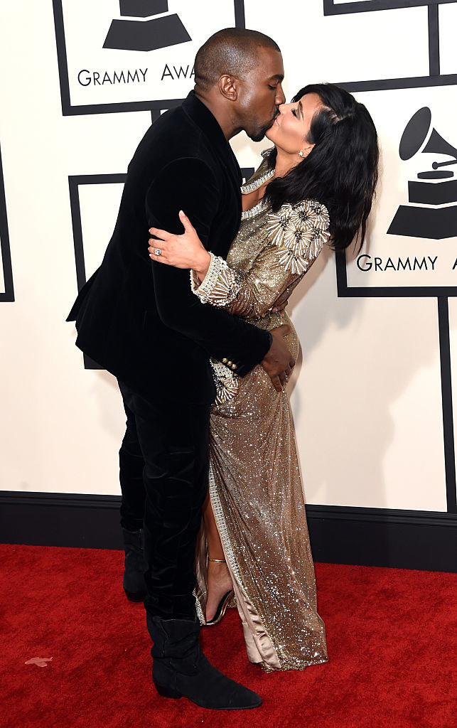 Kanye and Kim kissing on the red carpet