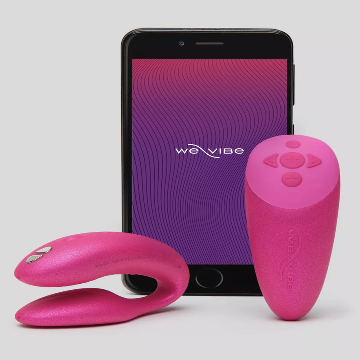 The vibrator with remote and app displayed on smartphone in the color pink