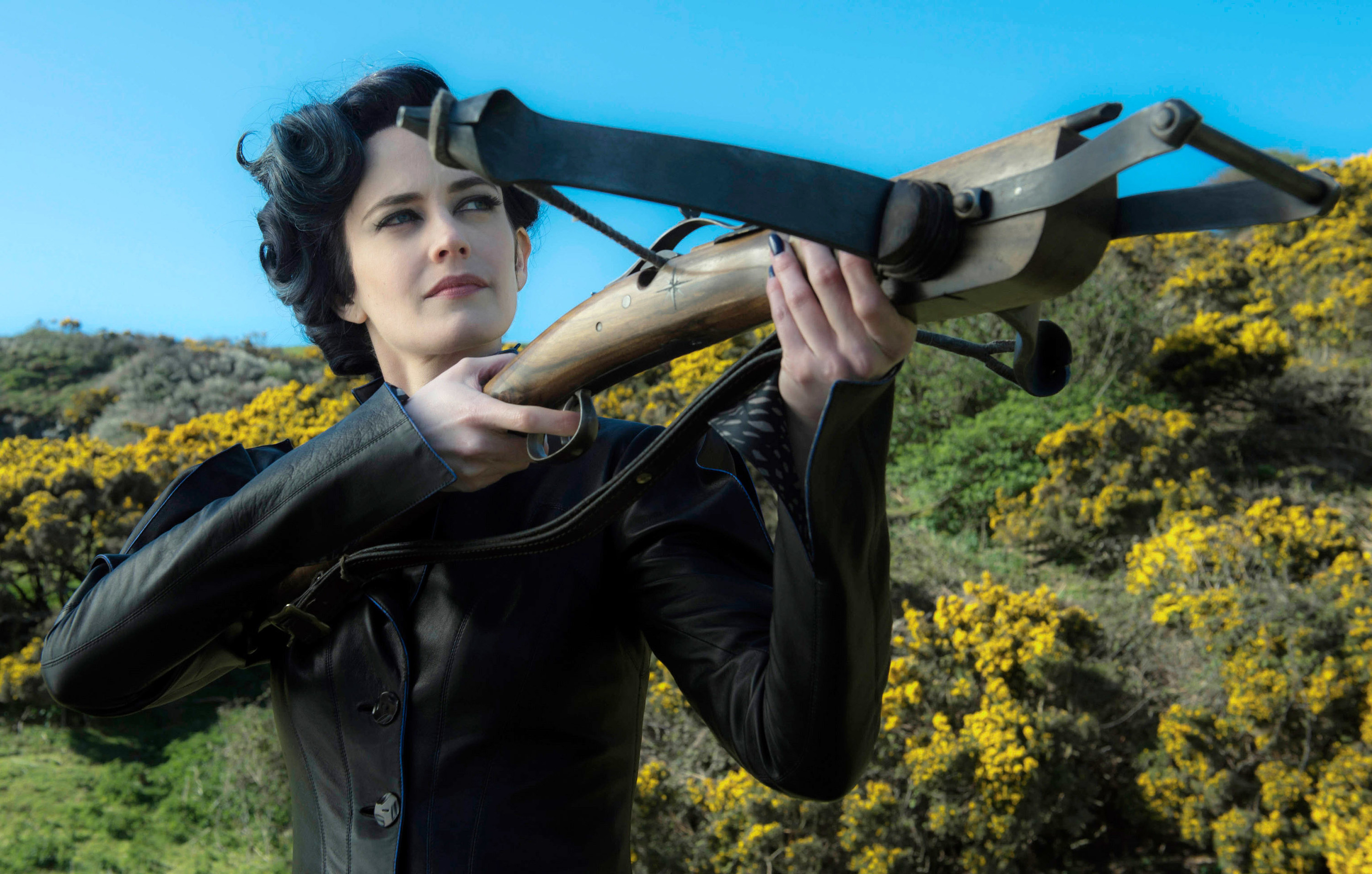 close up of Eva Green using an old wooden weapon to shoot