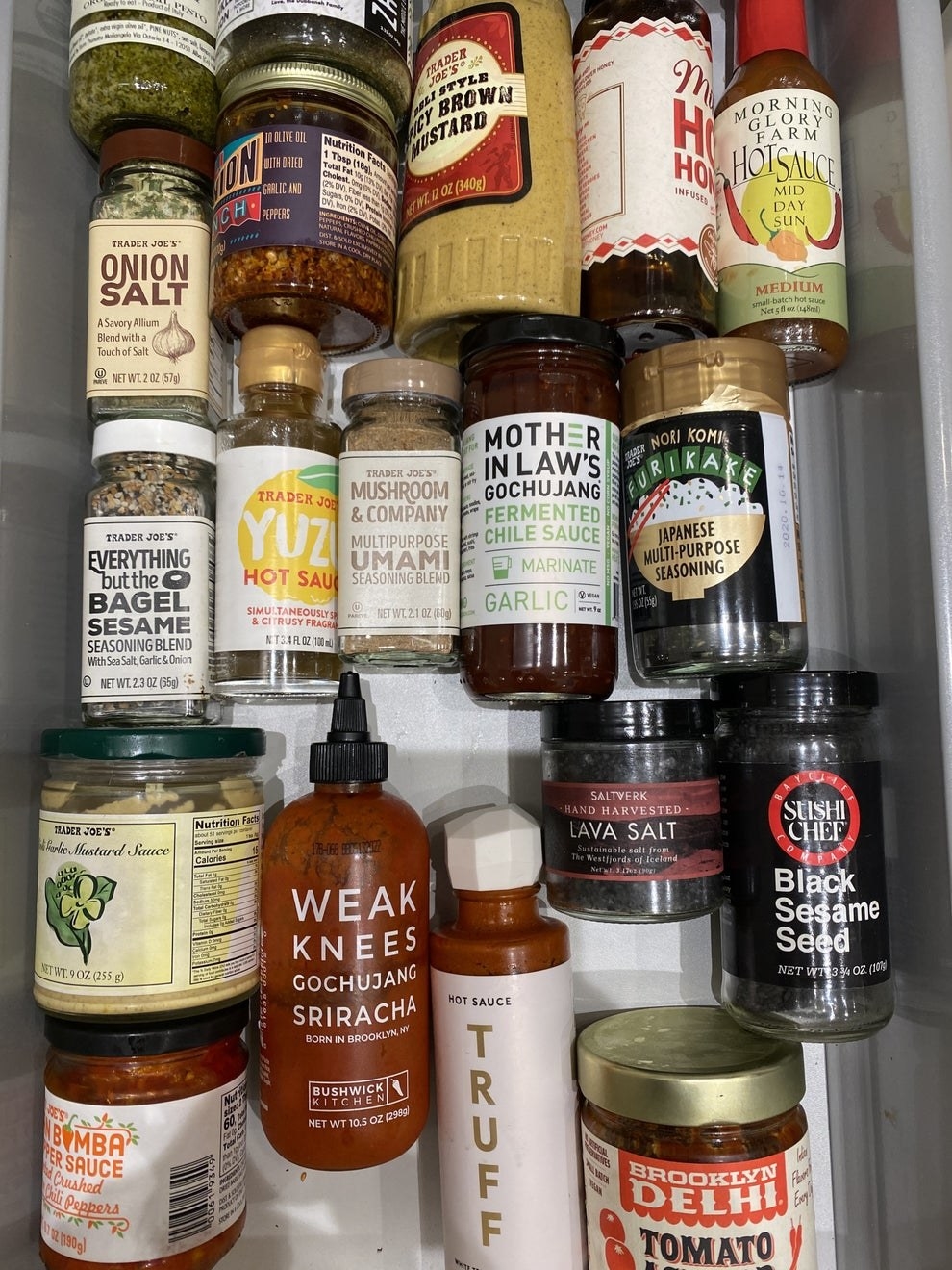 A bunch of condiments in a drawer.