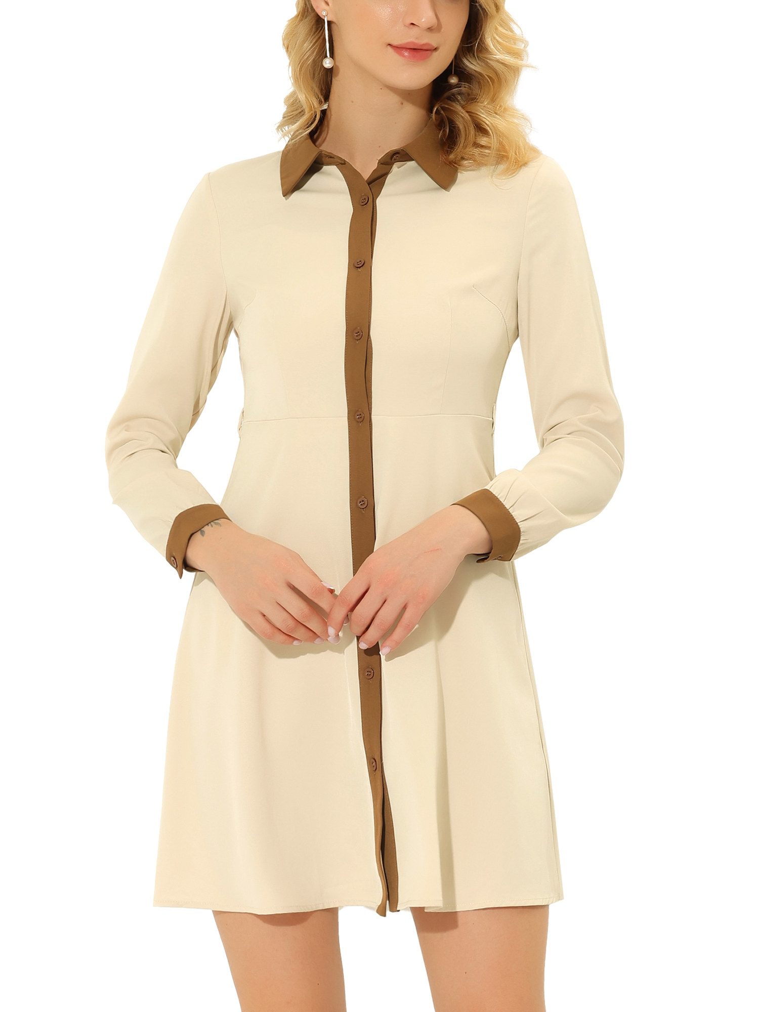 a model wearing the beige and tan long sleeve dress