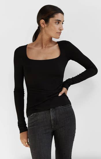 front view of a model wearing the top in black