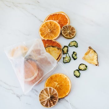 contents of the mesh bags: dried grapefruits, oranges, jalapeños, pineapples, and limes